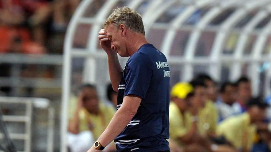 Manchester United manager David Moyes reacts during a match against the Singha All Stars in Bangkok.