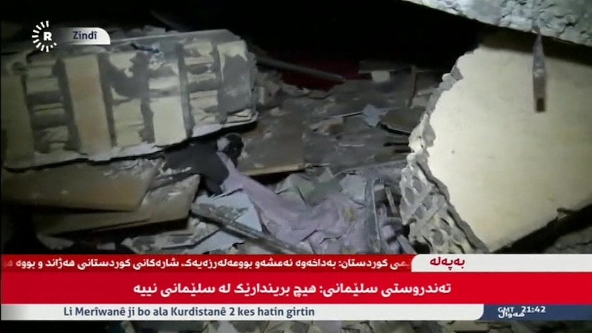 Kurdish TV shows destroyed buildings after the earthquake (Image: AP/Pouria Pakizeh)