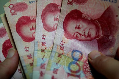 Re-valued: China has scrapped its peg to the US currency.