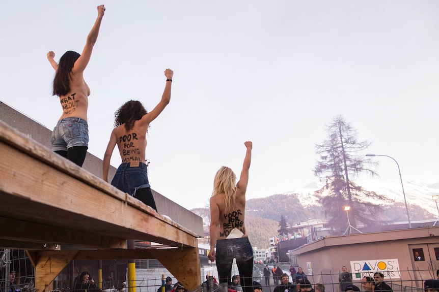 Topless activists protest at the World Economic Forum