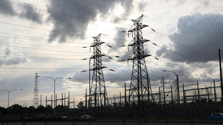 Powerlines string away from a powerstation. 