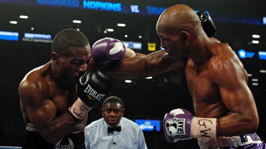 Bernard Hopkins (R) connects with a punch on Tavoris Cloud