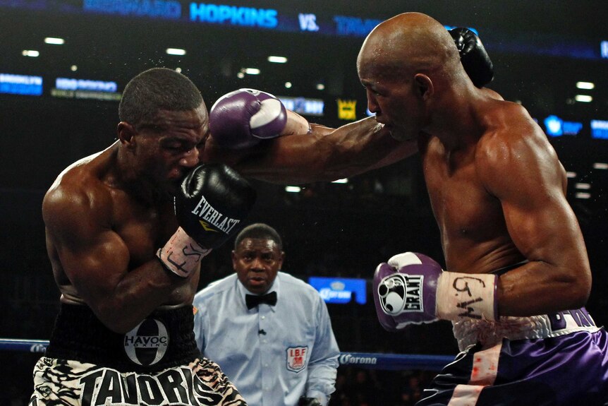 Bernard Hopkins (R) connects with a punch on Tavoris Cloud