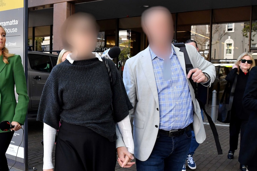 William Tyrrell's former foster parents, with faces blurred, are seen during a break at the Parramatta Local Court