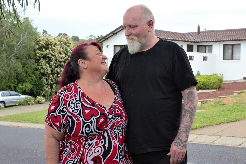 Natalie and Todd Malcolmson look into each others' eyes.