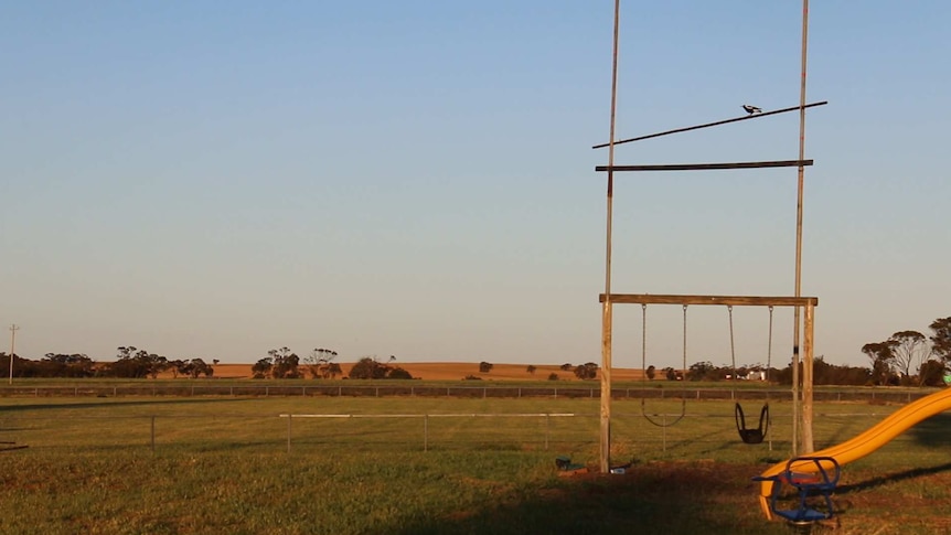 An empty playground beside where a disused football field in Patchewollock.