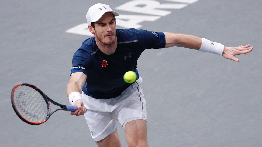 Britain's Andy Murray hits a return to Tomas Berdych at the Paris Masters on November 4, 2016.