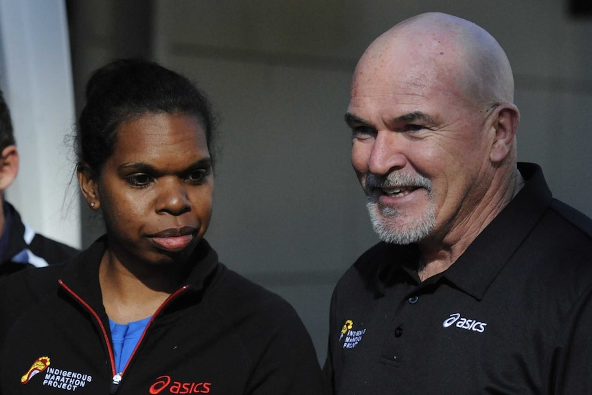 Robert de Castella with Emma Cameron of the Indigenous Marathon Project speaking at a media conference.