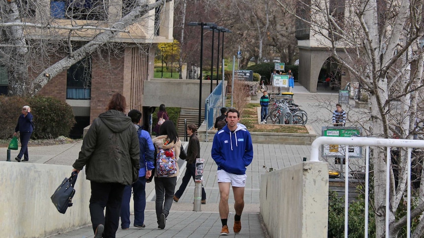 Students at Australian National University campus in Canberra during winter.