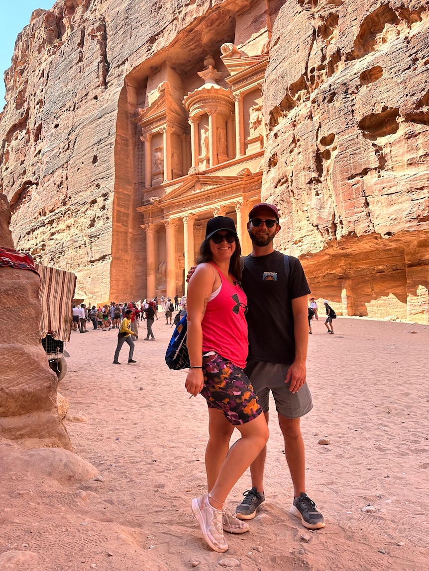 Couple standing outside Petra, Jordan.