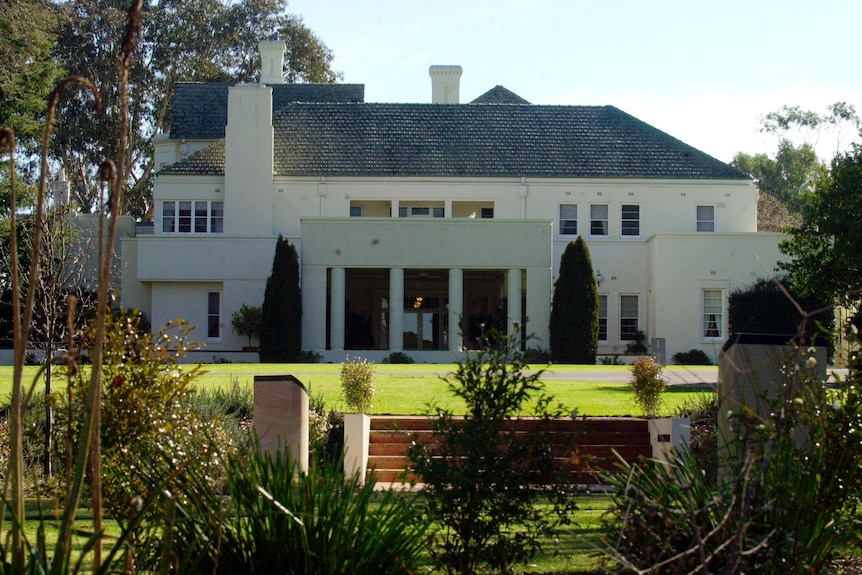 The backyard of Government House, with large terraced lawns.