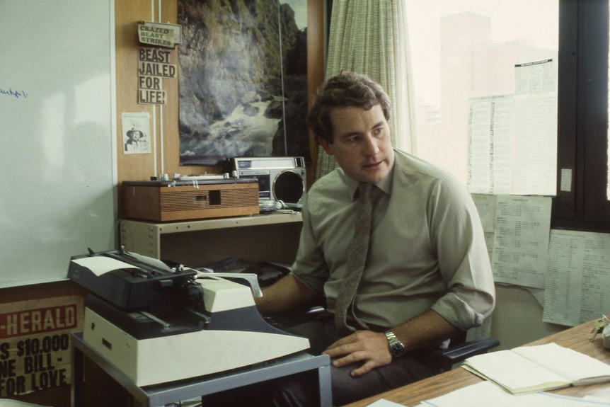 Archival image of an unidentified man at a typewriter at the ABC Radio offices in 1987.