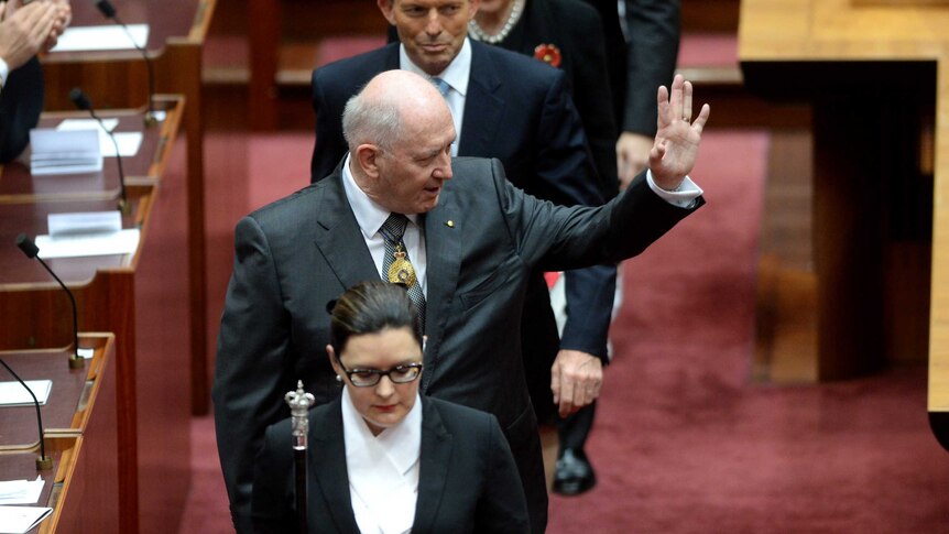 Governor-General Sir Peter Cosgrove waves as he leaves the Senate chamber after his swearing in.