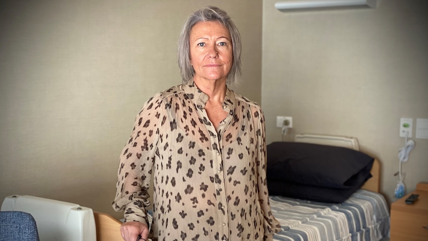 Yaandina Community Services CEO Sue Leonard standing in front of an aged care bed.