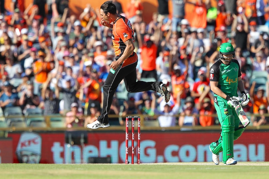 Mitchell Johnson celebrates dismissing Stars opener Luke Wright in the first over