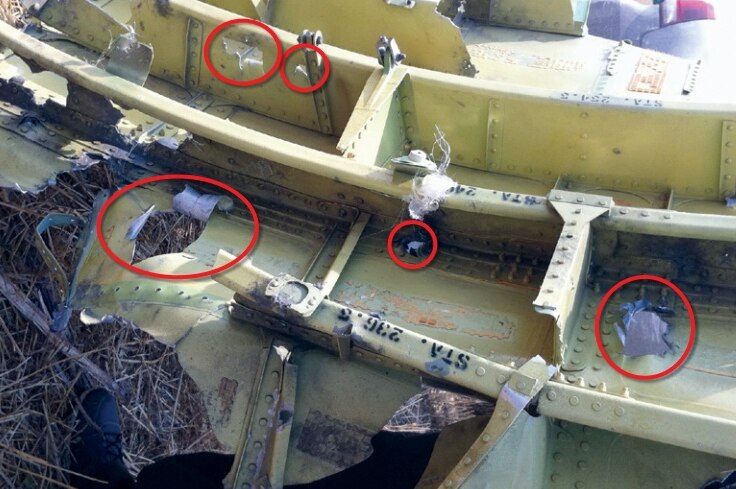 MH17 cockpit roof showing penetration from outside
