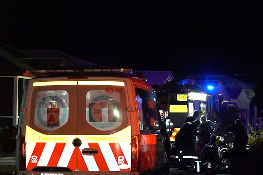 An ambulance at the scene of a night-time incident at a retirement.
