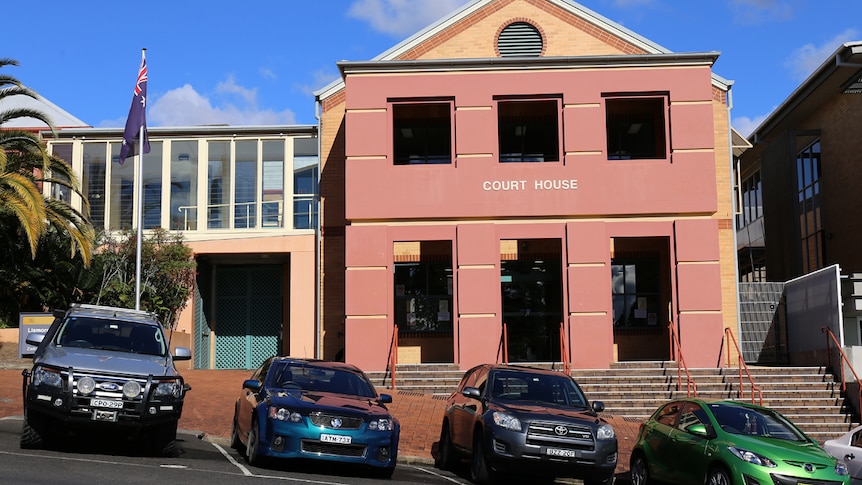 Lismore Court House with cars parked out the front.