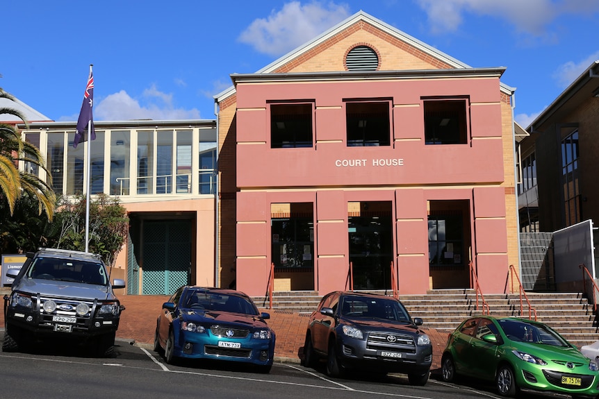 Lismore Court House with cars parked out the front.