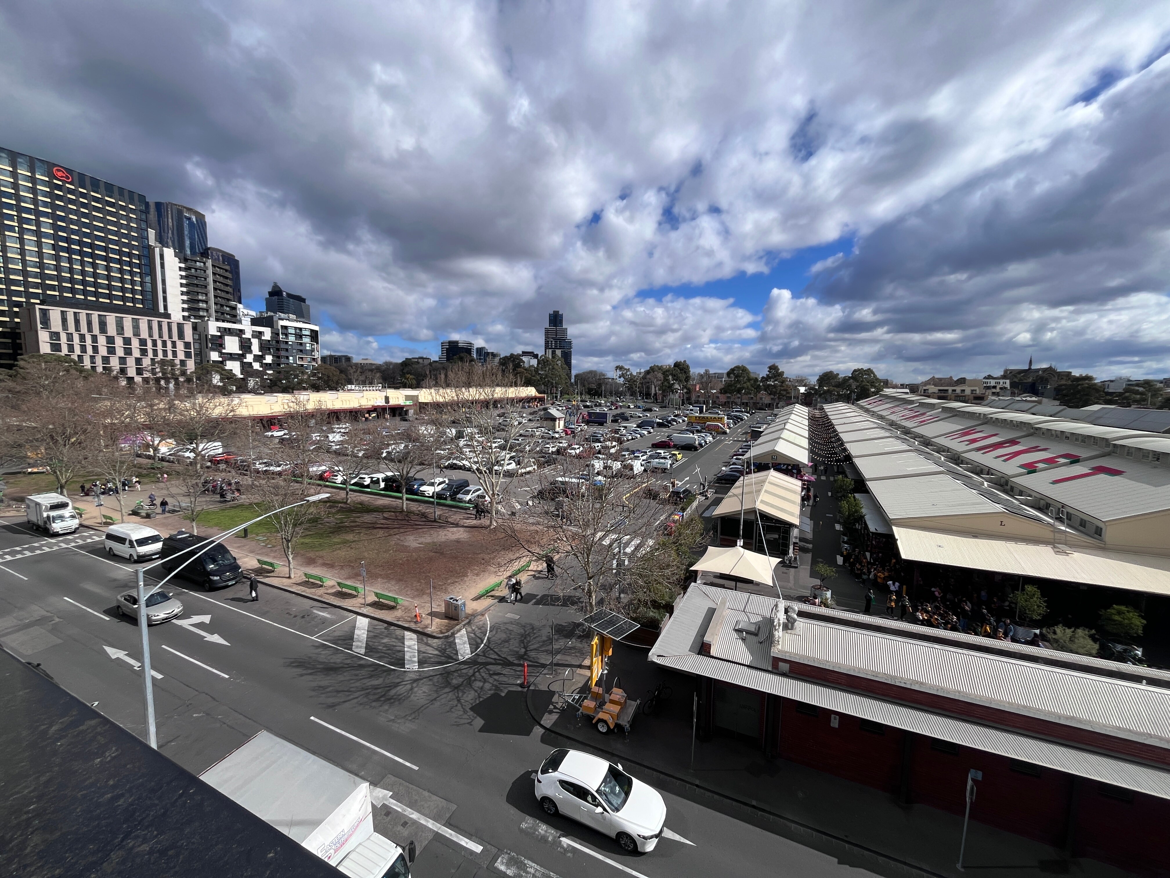 A large carpark next to a market. 