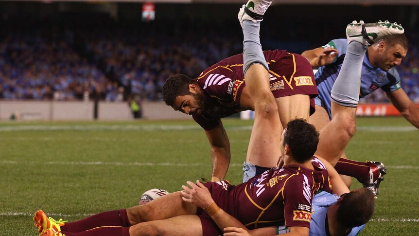 Greg Inglis of the Maroons scores a try