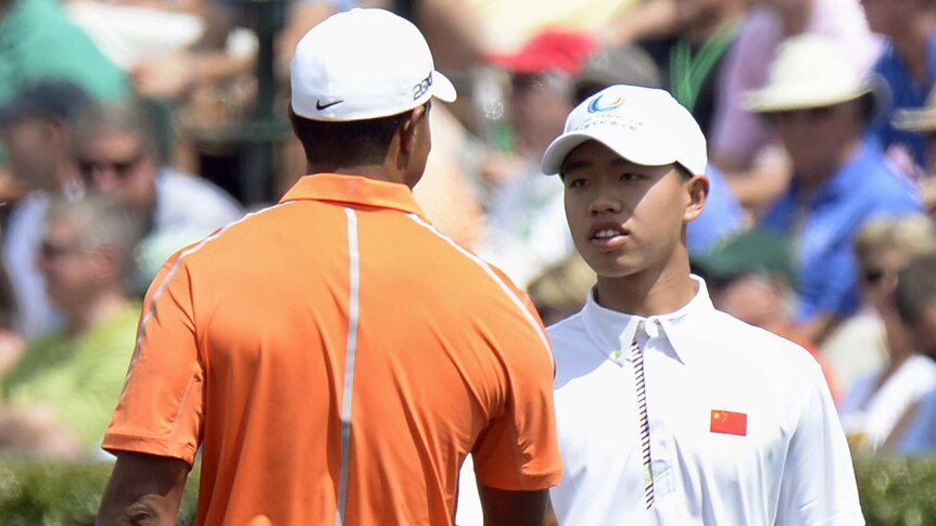 Tiger Woods and China's Guan Tianlang during a practice round at Augusta ahead of the US Masters.