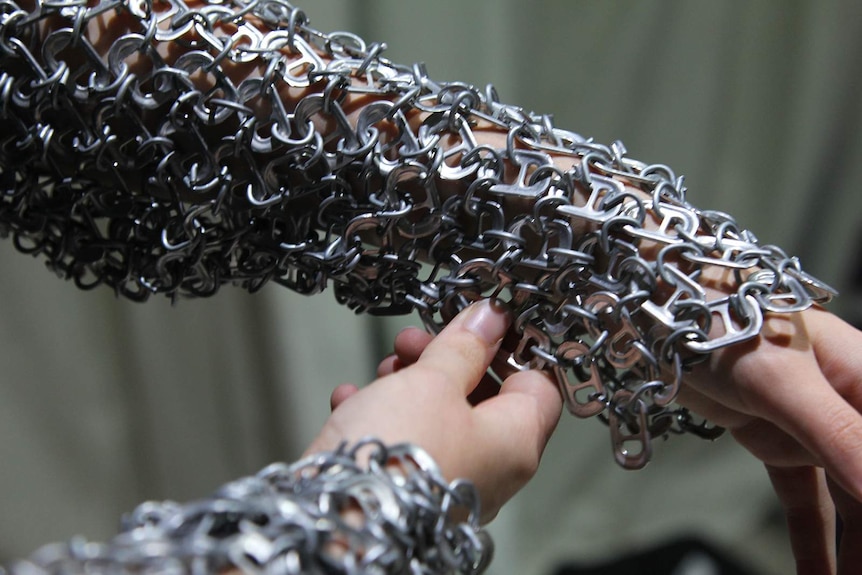 A close-up of the detailed chain of ringpulls in the bolero.