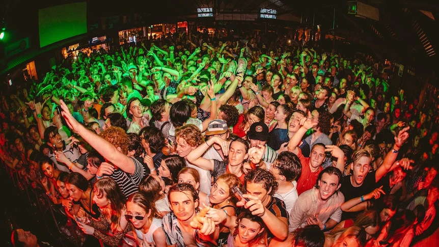 Crowd of young people at Byron Bay's Beach hotel