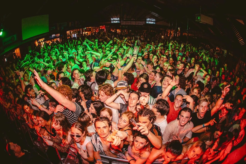 Crowd of young people at Byron Bay's Beach hotel