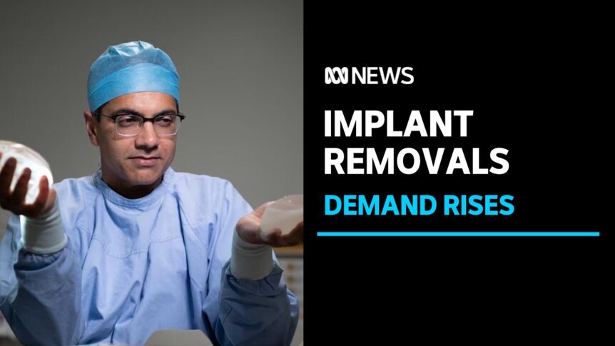 Implant removals, Demand rises: A man in blue scrubs and surgeon cap holds two implants in each hand. 