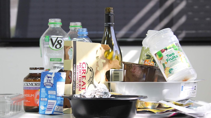 A photo of a collection of recyclable rubbish on a table.