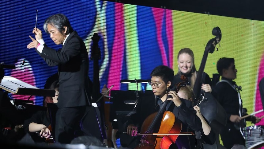 A close-up image of the Queensland Symphony Orchestra musicians playing at the AFL Grand Final.