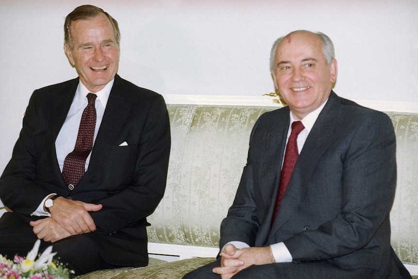 Then US President George H. Bush and Mikhail Gorbachev sit together at the Soviet Embassy.