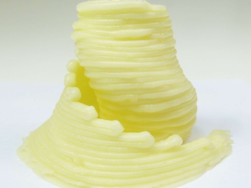 A spiral of cheese from a 3D printer.