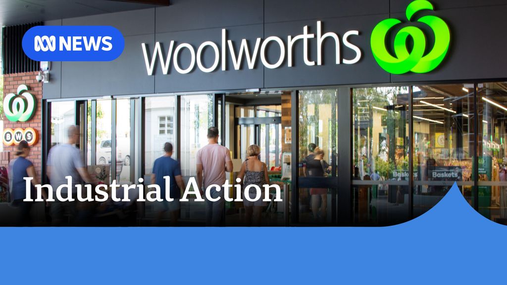 Industrial Action: Shoppers enter a Woolworths store through sliding entrance doors.