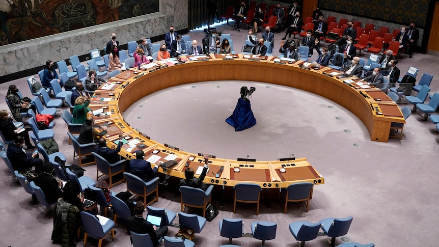 A group of diplomats attend a meeting at the UN Security Council headquarters. 