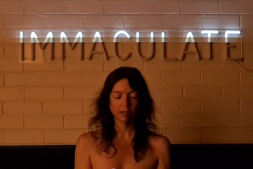 A naked person with the words "immaculate" behind them. The text "Cycle 13" is overlaid.