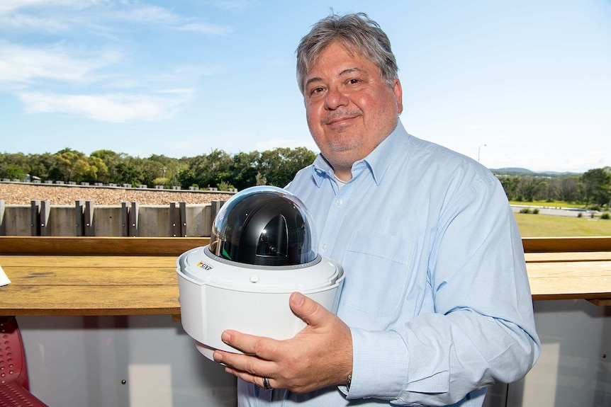 Fireball CEO Christopher Tylor with a fire-detection camera.