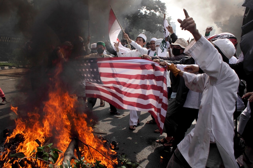 US flag burned by Indonesian Muslims protesting against a film mocking the Prophet Mohammad.