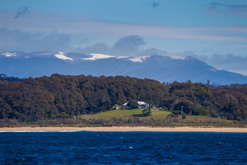 snow on the mountains from the ocean