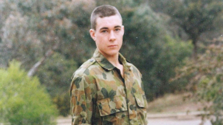 A young man in Army fatigues