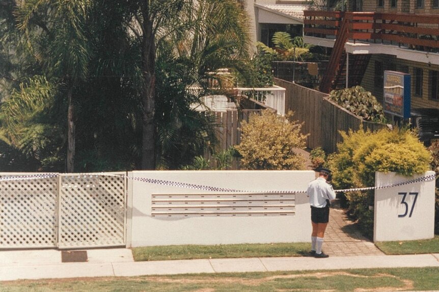 A Queensland police officer standing outside the cordoned off street in Surfers Paradise in 1991.