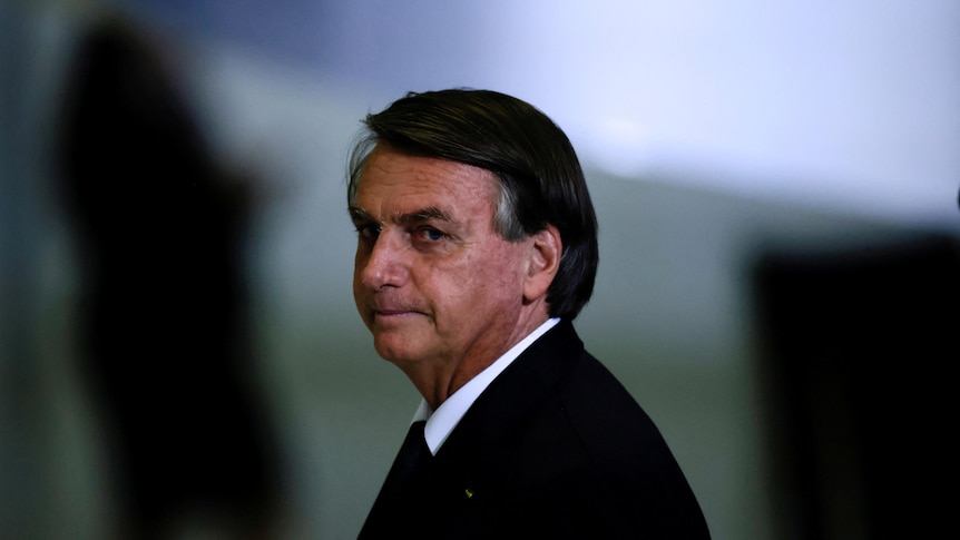 Jair Bolsonaro looks on after a ceremony about the National Policy for Education at the Planalto Palace in Brasilia.