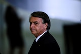 Jair Bolsonaro looks on after a ceremony about the National Policy for Education at the Planalto Palace in Brasilia.