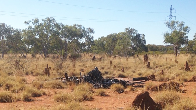 An outback helicopter crash, wreckage is completely destroyed.