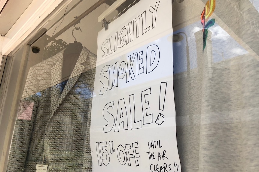 "Slightly smoked sale sign" in the window of a Peregian business.