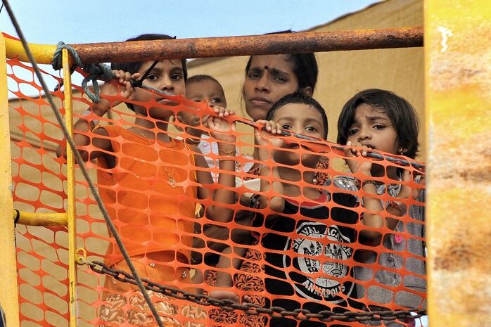 Young Sri Lankan asylum seekers look out from the Oceanic Viking (AFP: Roslan Rahman)