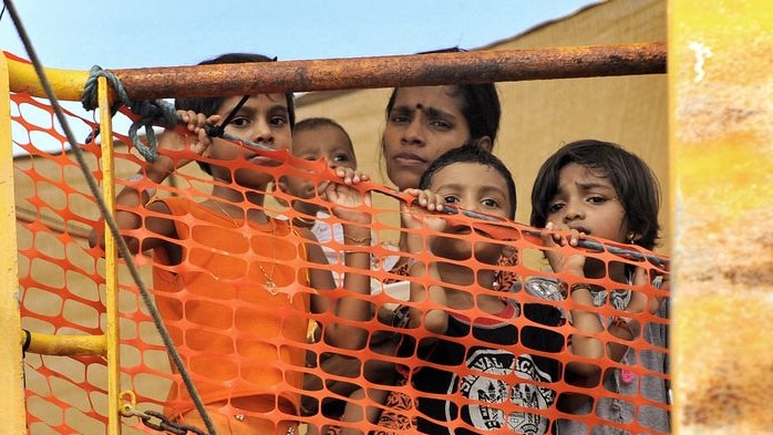 Young Sri Lankan asylum seekers look out from the Oceanic Viking (AFP: Roslan Rahman)