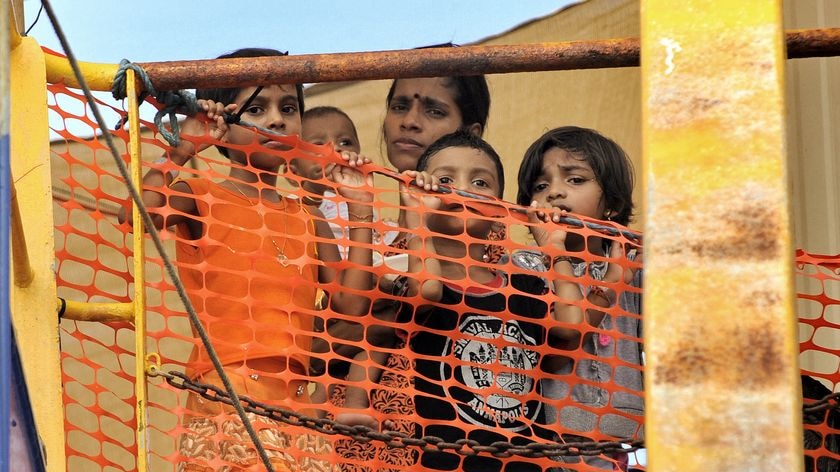 Young Sri Lankan asylum seekers look out from the Oceanic Viking