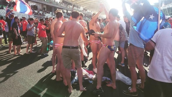 Australian men in Malaysian flag swimmers